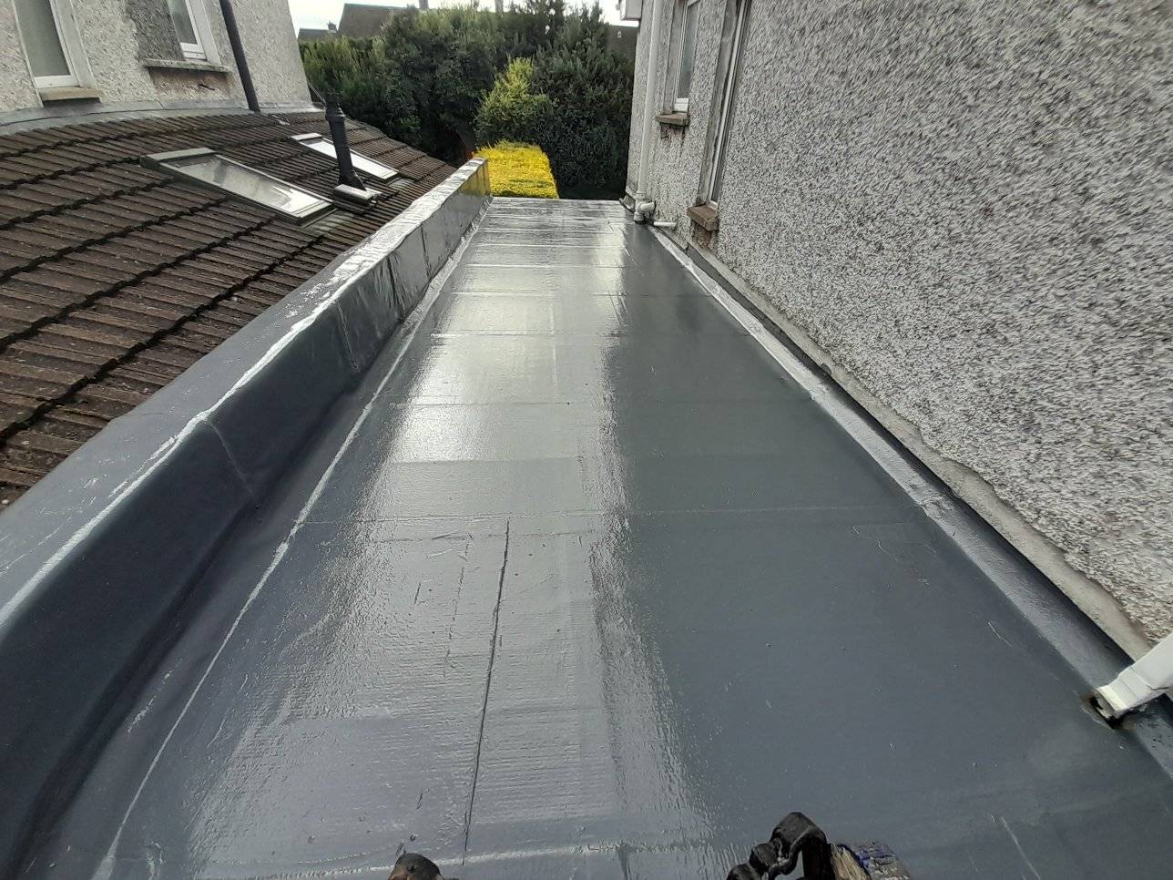 Flat roof with a leaking skylight being repaired in Dublin  