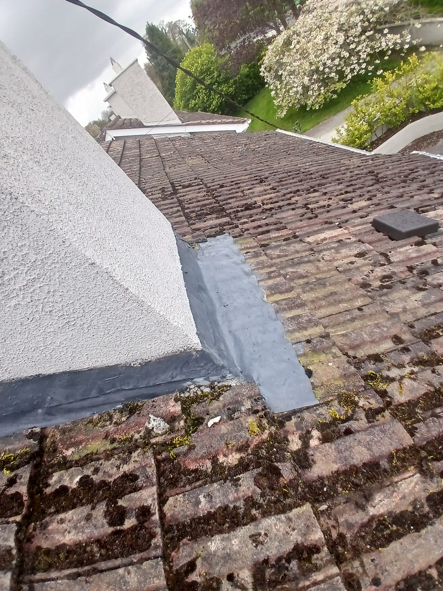 The front of a roof chimney with lead repaired and rubber seal applied