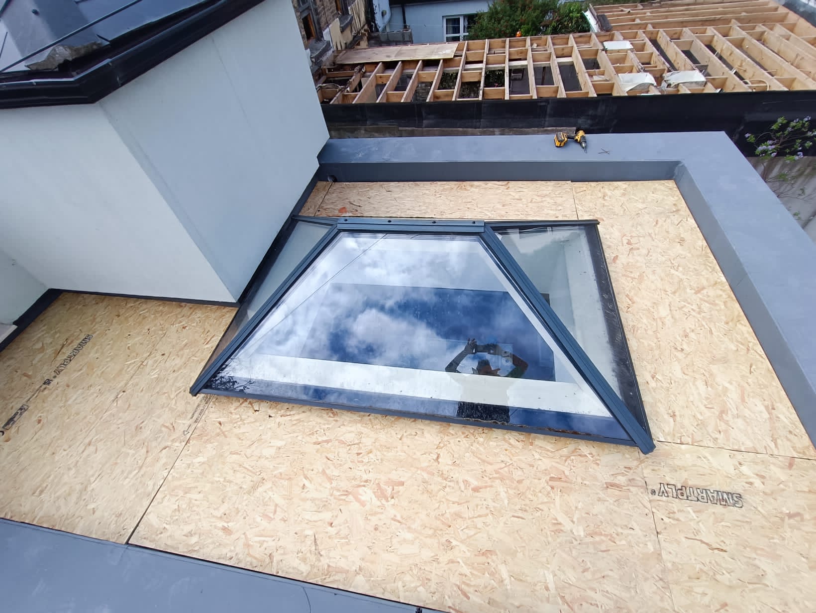 image of a flat roof replaced in Dublin with a new osb timber installed.