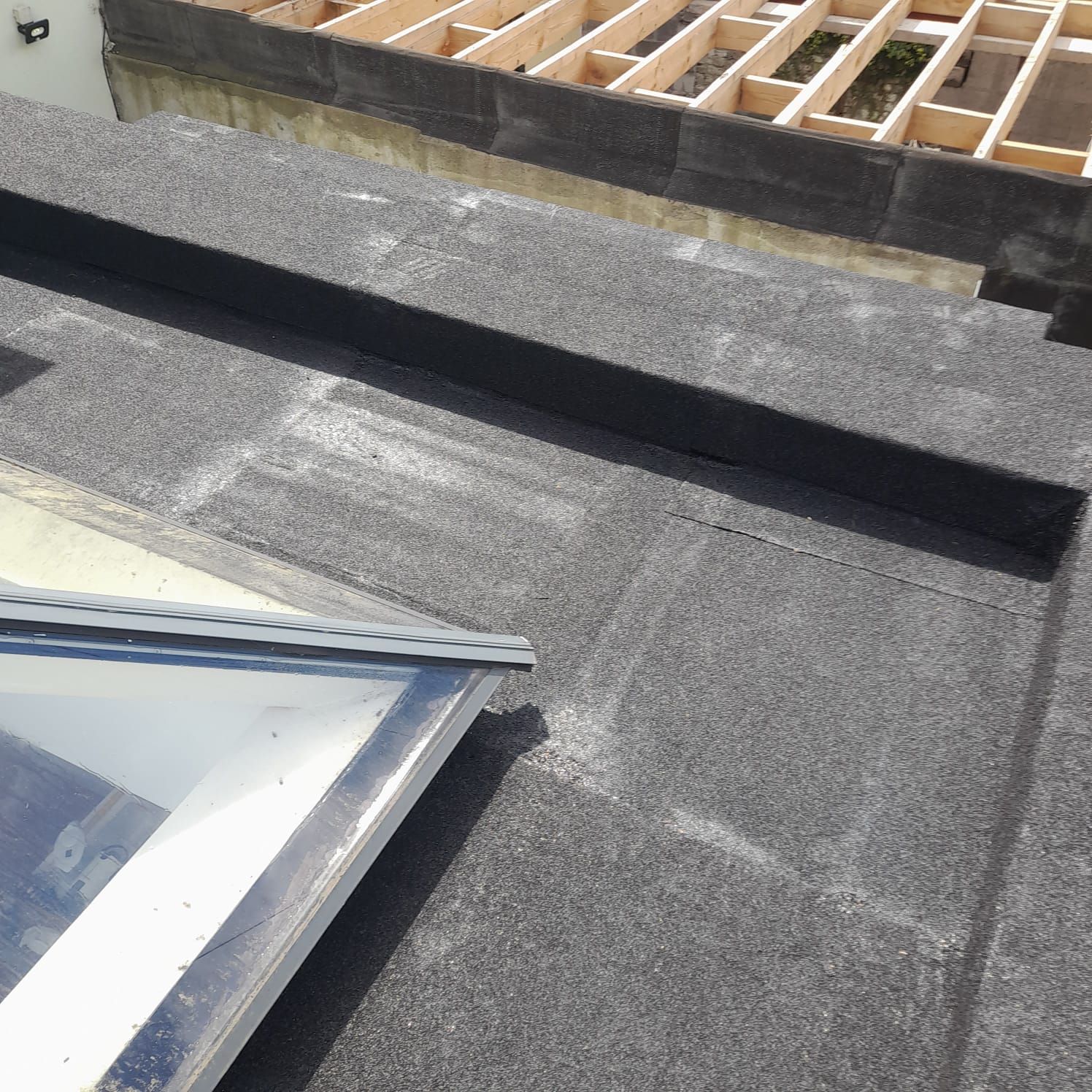 New roof felt after being installed on a flat roof in Dublin