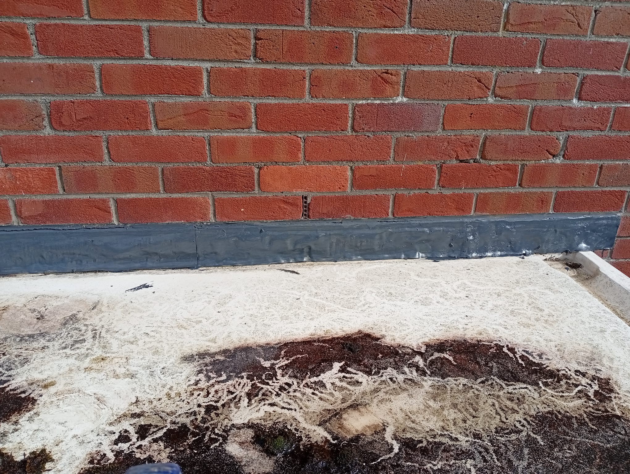 flat roof flashing on a house in Dublin being repaired after a storm leak