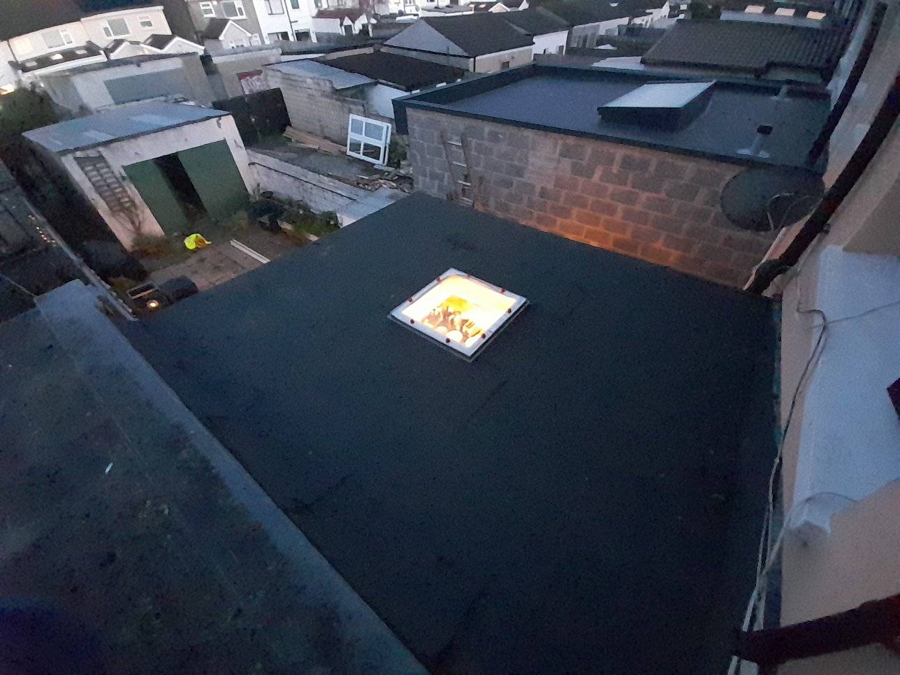image of a flat glass type skylight installed in a flat roof