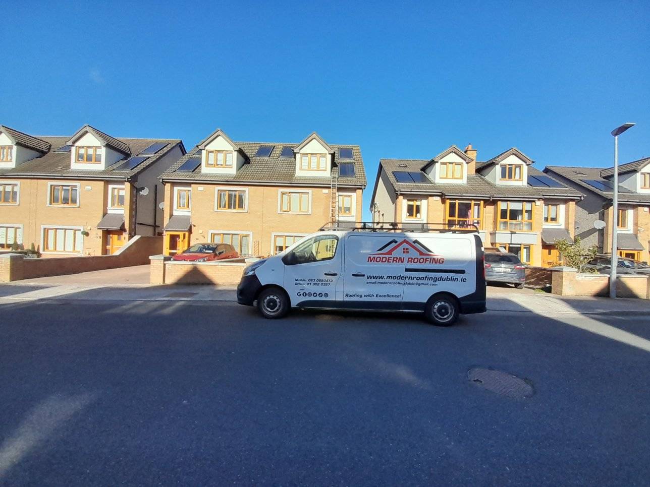 van parked outside a house in Dublin carrying out emergency roof repairs